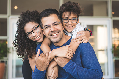 Family of three smiling